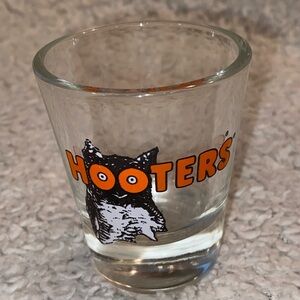 Hooter’s shot glass,  white orange with owl logo, no city specified